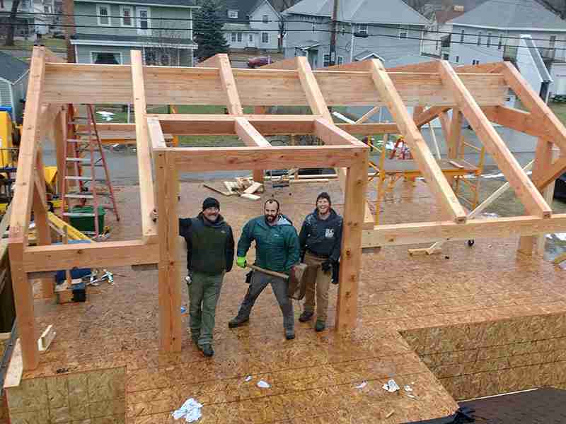Baraboo Timber Frame - a few people standing in a recently built structure